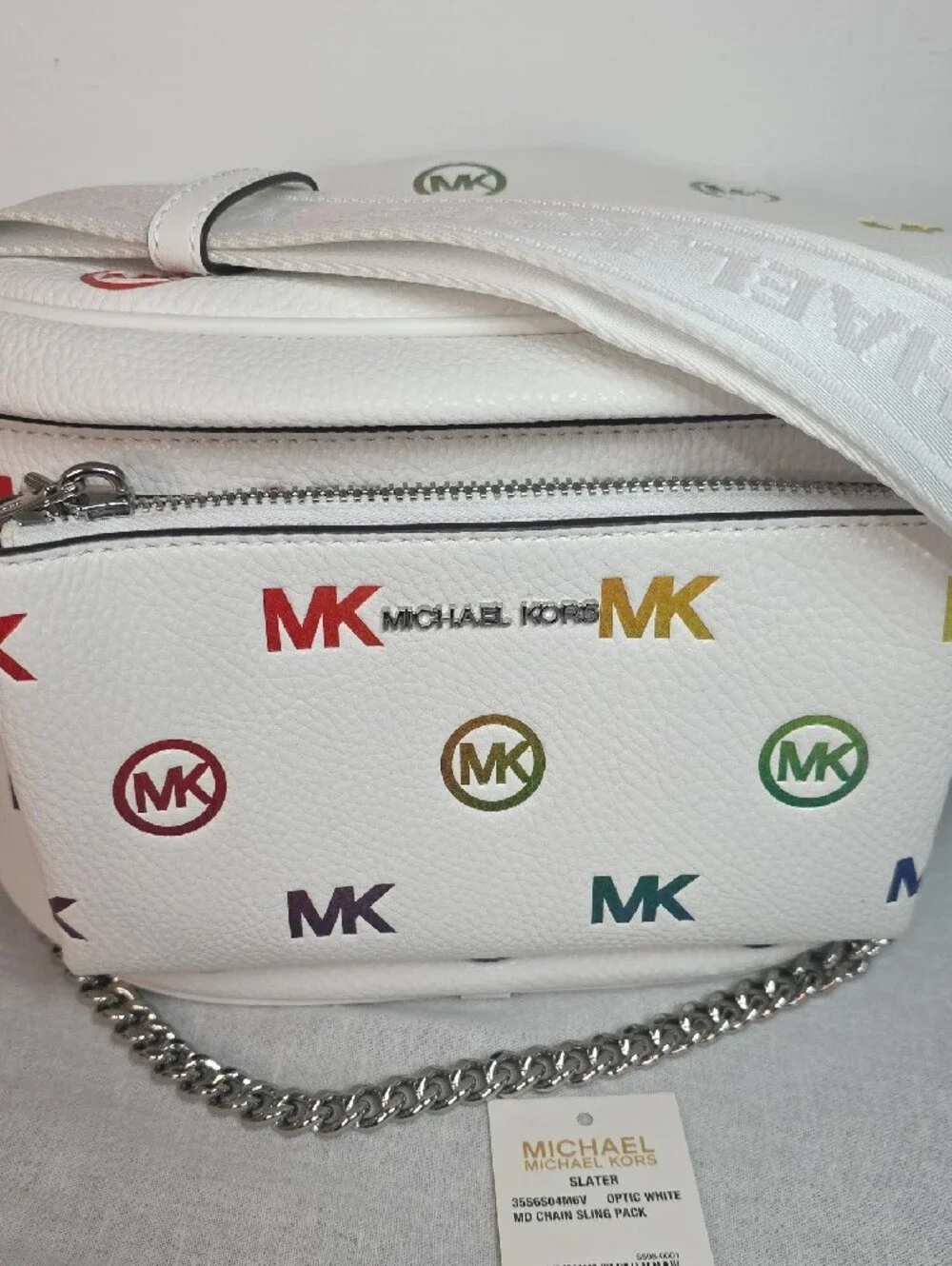 Michael Kors Slater Medium Rainbow Logo Embossed Sling Pack in Optic White
